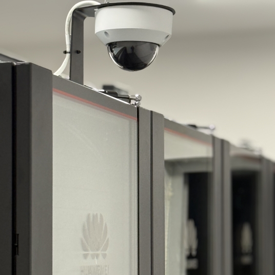 Modular data center Huawei FusionModule 800 for a utility organization, featuring N+1 UPS, in-row cooling, DCIM and integrated physical security.